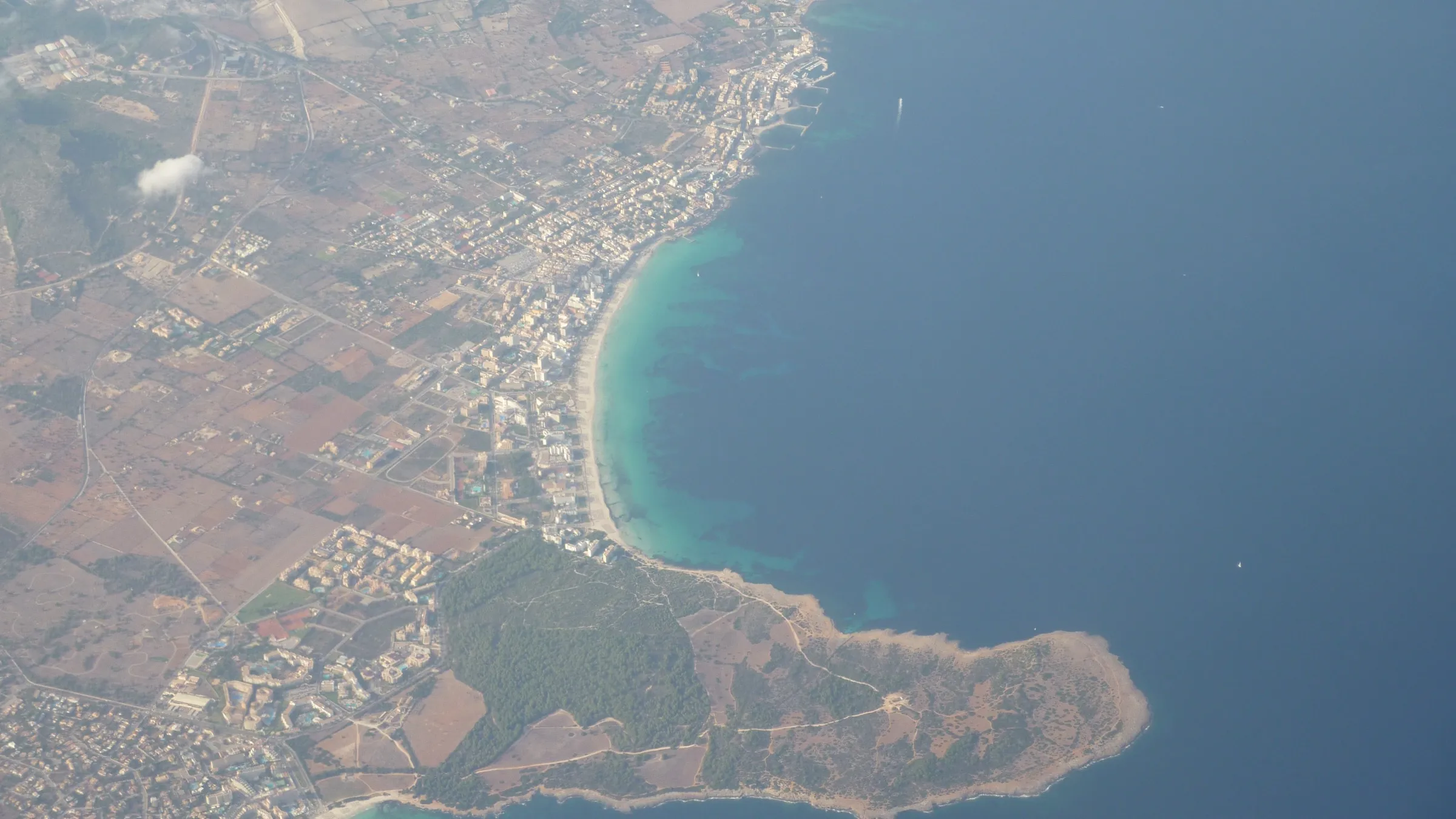 Aerial view of the bay of Cala Millor, with the strip of sand and the sa Punta de n'Amer peninsula